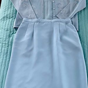 Blue sweater set with matching skirt
